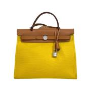 Pre-owned Fabric handbags Hermès Vintage , Yellow , Dames