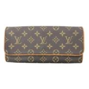 Pre-owned Canvas clutches Louis Vuitton Vintage , Brown , Dames