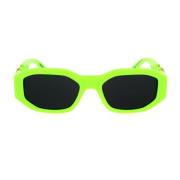 Zonnebril met onregelmatige vorm in fluorescerend groen en donkergrijs...