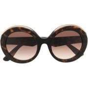 Stijlvolle zonnebril met bruin/Hawaïaans montuur en ovale glazen Dolce...
