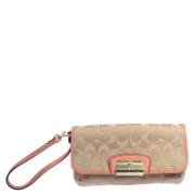 Pre-owned Canvas clutches Coach Pre-owned , Beige , Dames