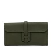 Pre-owned Leather clutches Hermès Vintage , Green , Dames