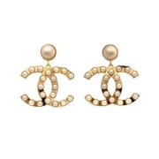 Pre-owned Metal earrings Chanel Vintage , Yellow , Dames