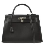 Pre-owned Leather handbags Hermès Vintage , Black , Dames