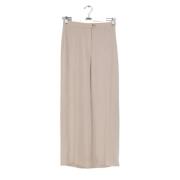 Pre-owned Polyester bottoms Hermès Vintage , Beige , Dames