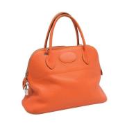 Pre-owned Leather handbags Hermès Vintage , Orange , Dames