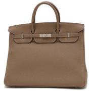 Pre-owned Fabric handbags Hermès Vintage , Brown , Dames