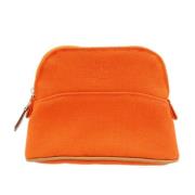 Pre-owned Fabric pouches Hermès Vintage , Orange , Dames