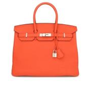 Pre-owned Leather handbags Hermès Vintage , Orange , Dames