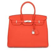 Pre-owned Leather handbags Hermès Vintage , Orange , Dames