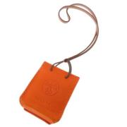 Pre-owned Fabric key-holders Hermès Vintage , Orange , Dames