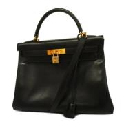 Pre-owned Leather handbags Hermès Vintage , Black , Dames