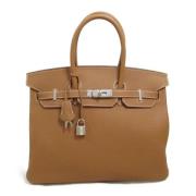 Pre-owned Leather handbags Hermès Vintage , Brown , Dames