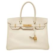 Pre-owned Leather handbags Hermès Vintage , Beige , Dames