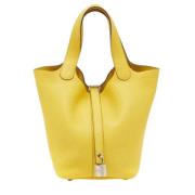 Pre-owned Leather handbags Hermès Vintage , Yellow , Dames