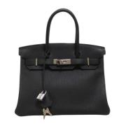 Pre-owned Leather handbags Hermès Vintage , Black , Dames