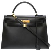 Pre-owned Leather handbags Hermès Vintage , Black , Dames