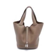 Pre-owned Leather handbags Hermès Vintage , Beige , Dames