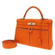 Pre-owned Leather handbags Hermès Vintage , Orange , Dames