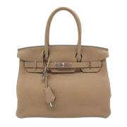 Pre-owned Leather handbags Hermès Vintage , Beige , Dames