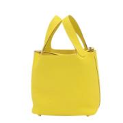 Pre-owned Leather handbags Hermès Vintage , Yellow , Dames