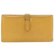 Pre-owned Leather wallets Hermès Vintage , Yellow , Dames