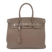 Pre-owned Leather handbags Hermès Vintage , Beige , Dames