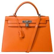 Pre-owned Leather handbags Hermès Vintage , Orange , Dames