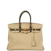 Pre-owned Canvas handbags Hermès Vintage , Beige , Dames