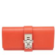 Pre-owned Leather clutches Hermès Vintage , Orange , Dames