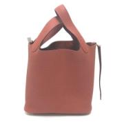 Pre-owned Leather handbags Hermès Vintage , Red , Dames