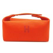 Pre-owned Canvas pouches Hermès Vintage , Orange , Dames