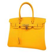 Pre-owned Leather handbags Hermès Vintage , Yellow , Dames