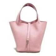 Pre-owned Leather handbags Hermès Vintage , Pink , Dames