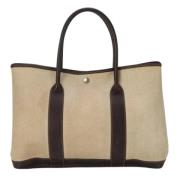 Pre-owned Canvas handbags Hermès Vintage , Beige , Dames