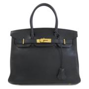 Pre-owned Fabric handbags Hermès Vintage , Black , Dames