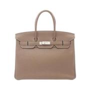 Pre-owned Leather handbags Hermès Vintage , Brown , Dames