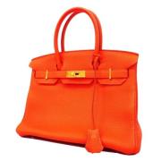 Pre-owned Leather handbags Hermès Vintage , Orange , Dames