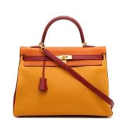 Pre-owned Leather handbags Hermès Vintage , Yellow , Dames