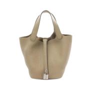 Pre-owned Leather handbags Hermès Vintage , Beige , Dames