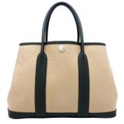 Pre-owned Canvas handbags Hermès Vintage , Beige , Dames