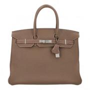 Pre-owned Leather handbags Hermès Vintage , Beige , Dames