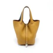 Pre-owned Leather handbags Hermès Vintage , Yellow , Dames