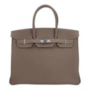 Pre-owned Leather handbags Hermès Vintage , Beige , Dames