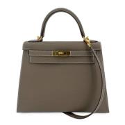 Pre-owned Leather handbags Hermès Vintage , Beige , Dames