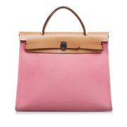 Pre-owned Canvas handbags Hermès Vintage , Pink , Dames