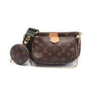 Pre-owned Canvas clutches Louis Vuitton Vintage , Green , Dames