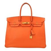 Pre-owned Leather handbags Hermès Vintage , Orange , Dames