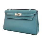 Pre-owned Leather clutches Hermès Vintage , Blue , Dames