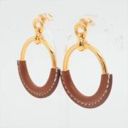 Pre-owned Metal earrings Hermès Vintage , Yellow , Dames